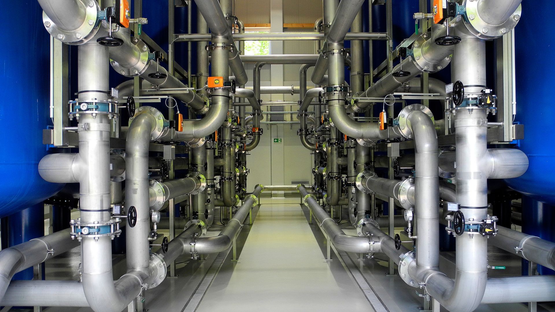 Clean water flowing through industrial filtration equipment